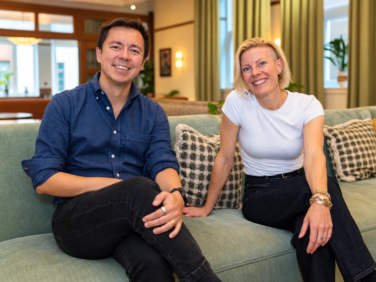 Pillar's founders, Sebastian Cameron (left) and Alice Pillar (right), sitting together on a sofa